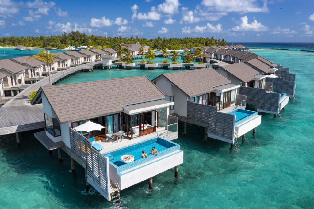 ATMOSPHERE KANIFUSHI MALDIVES - SUNSET WATER VILLA WITH POOL - AERIAL - EXTERIOR VIEW 03 - LIFESTYLE