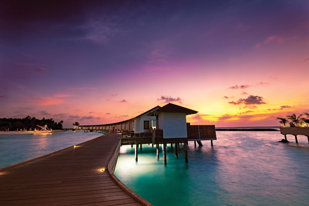 ATMOSPHERE KANIFUSHI MALDIVES - VILLAS - Water Villa Jetty at Sunset